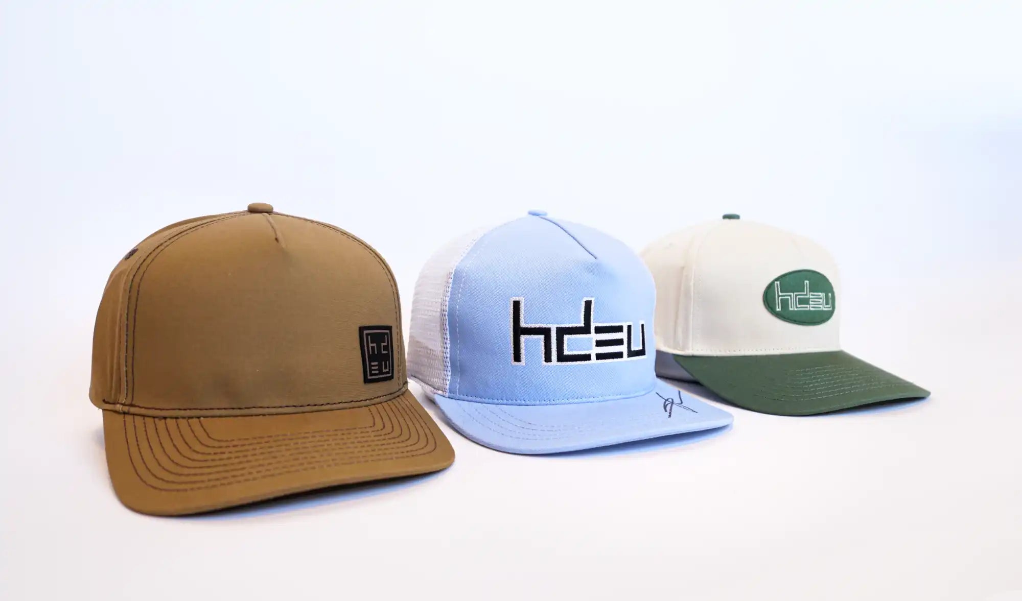 Three different baseball caps.